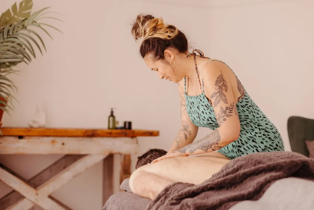 Swedish massage therapist performing back massage Bath city centre